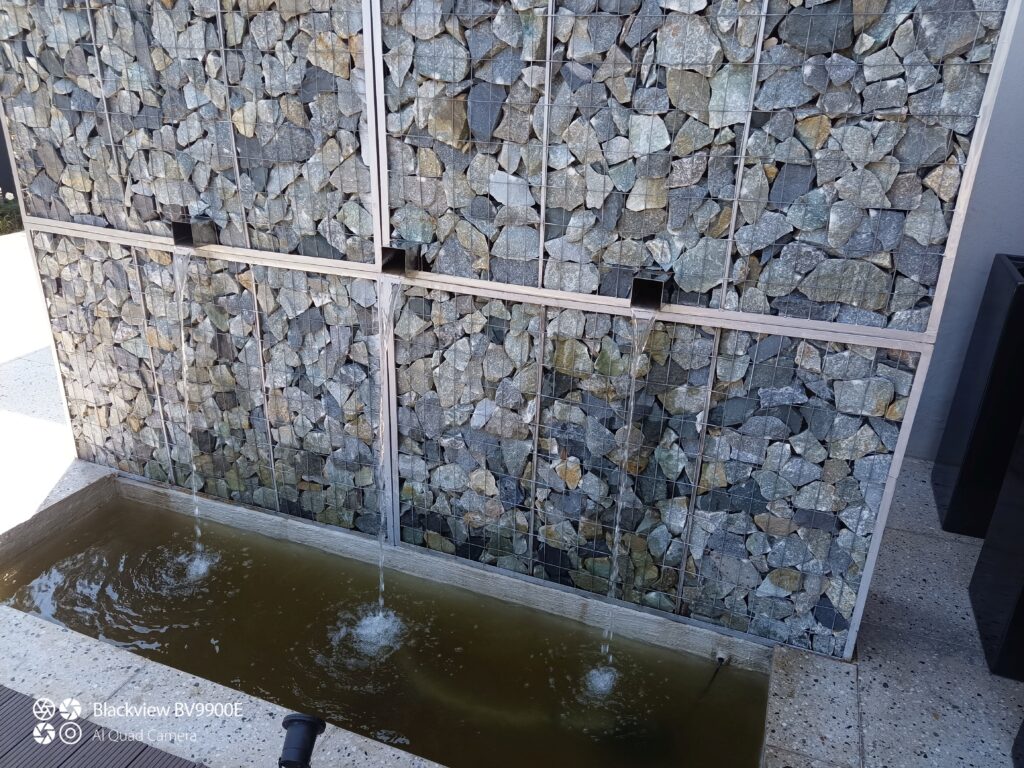 "modern gabion rock waterfeature"